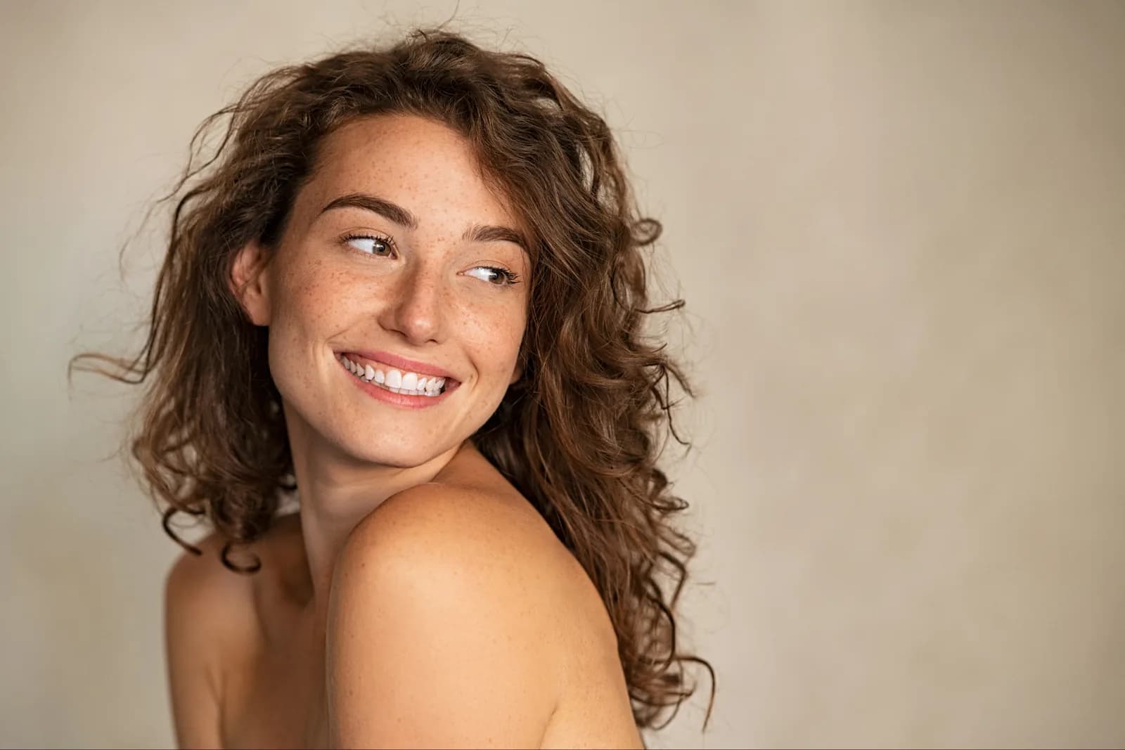 Woman with a bright, natural smile after cosmetic dentistry