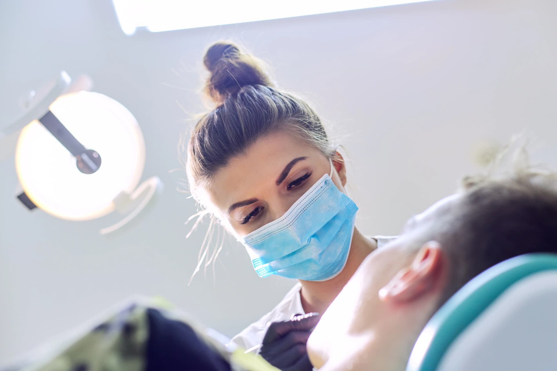 Hygienist providing periodontal gum care