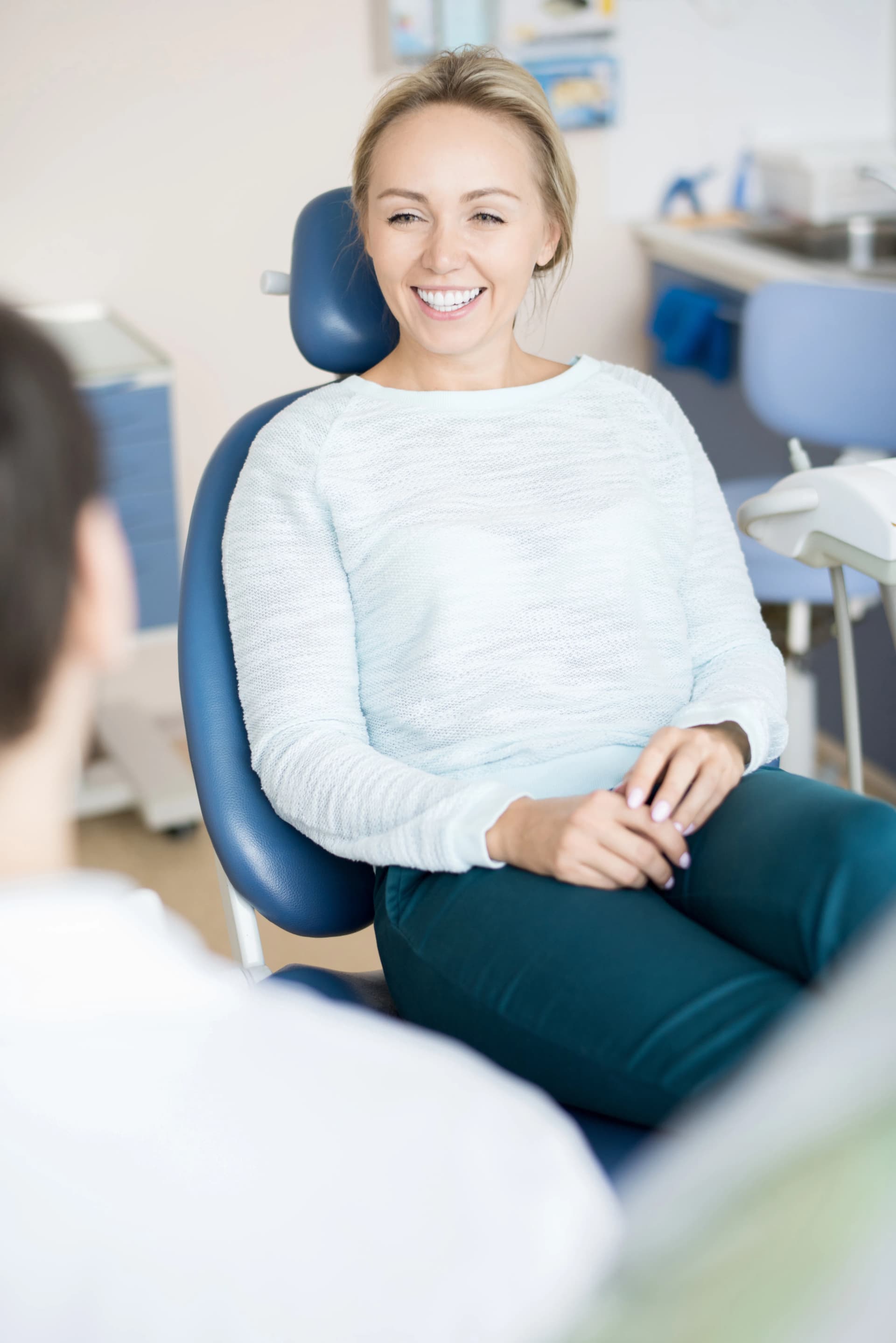 Smiling patient relaxing in the dental chair